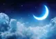 Black cloudy sky with glowing crescent moon and stars