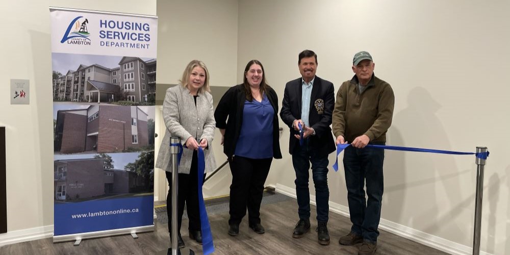 Staff and Council members attend a ribbon cutting in Maxwell Park Place