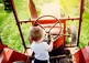 Child driving a tractor.