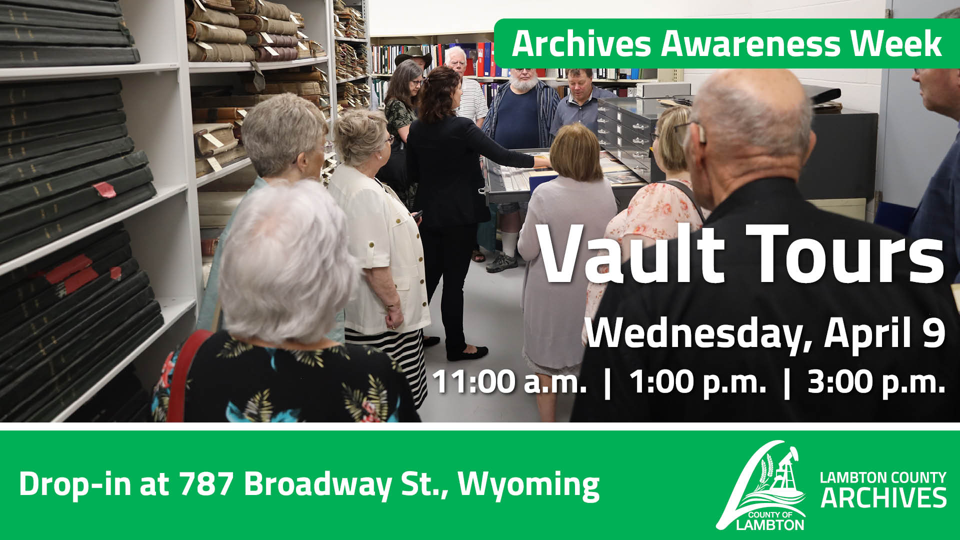 A group of people take a tour through the vault at Lambton County Archives