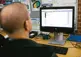 Person sitting in front of a computer.