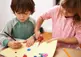 Kids crafting with paper and beads