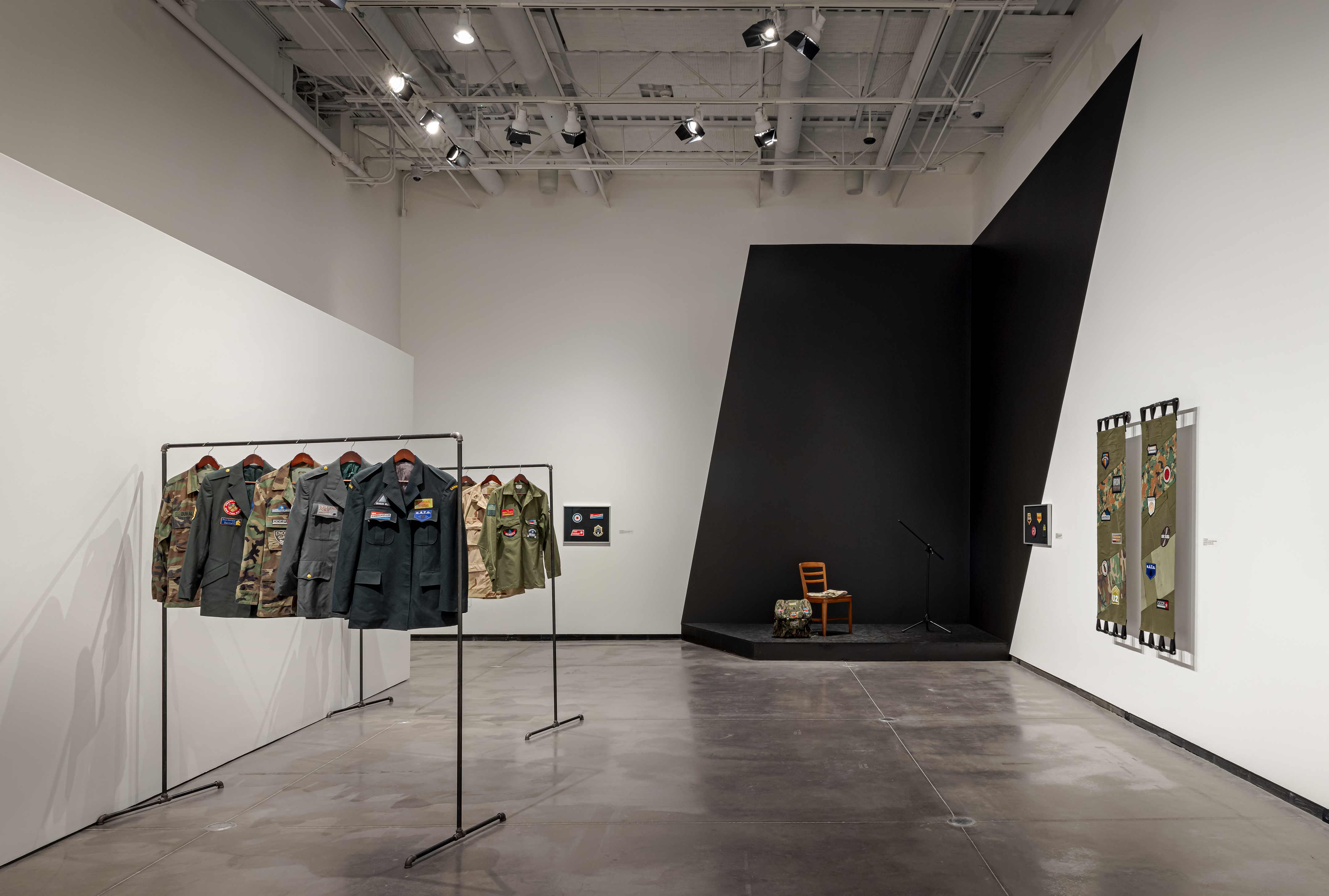 An Abridged Sonic History of Global Conflict Military Clothes display and performance stand